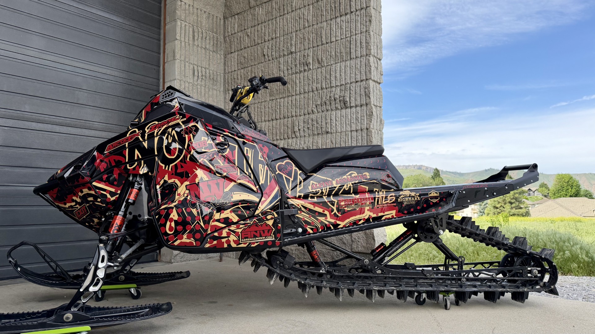 A Polaris Matryx Mountain snowmobile with a custom NWFR custom vinyl wrap.