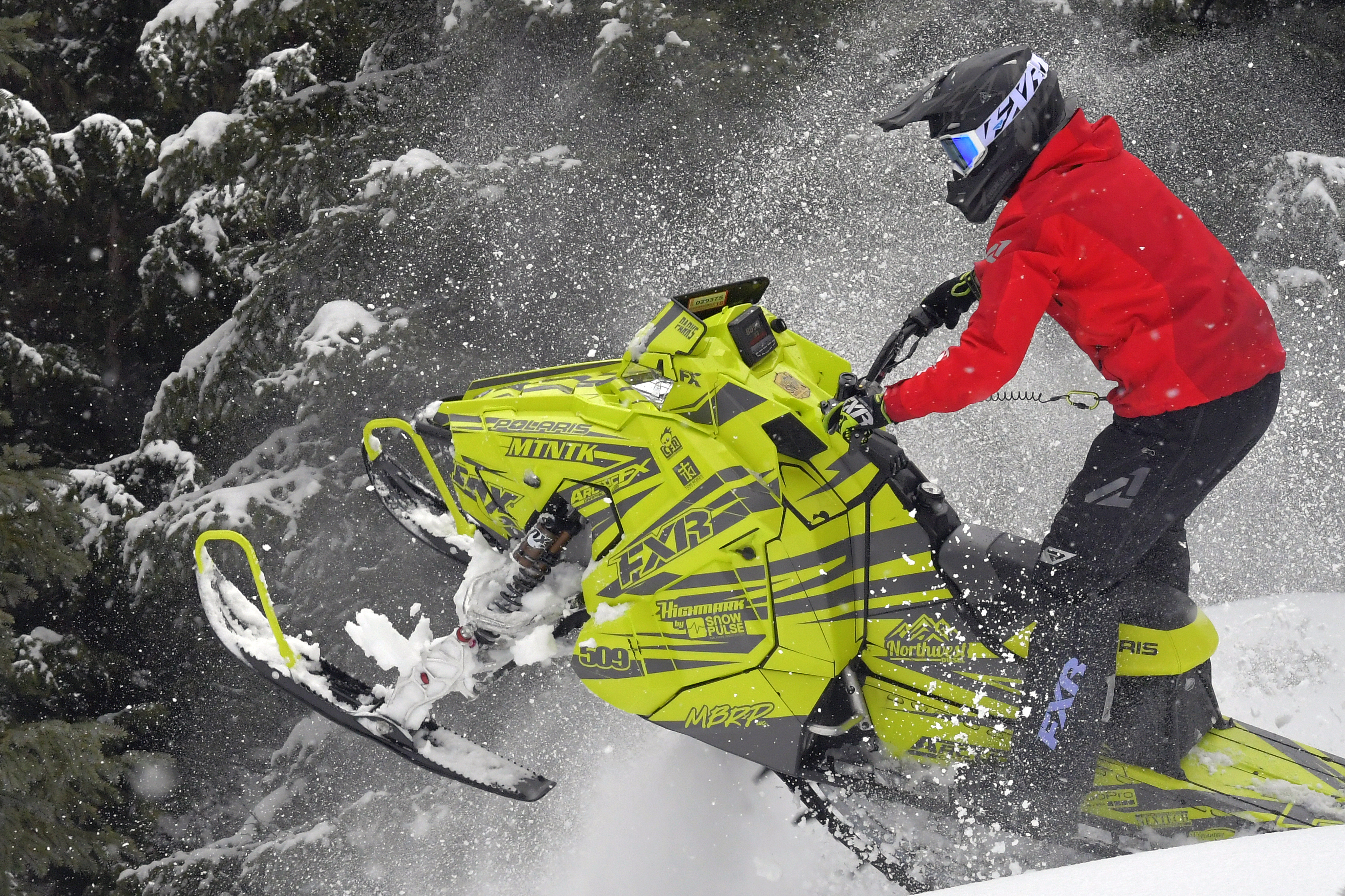 A Polaris Axys Mountain snowmobile with a lime squeeze and gray stripes Burandt Evolution custom vinyl wrap.