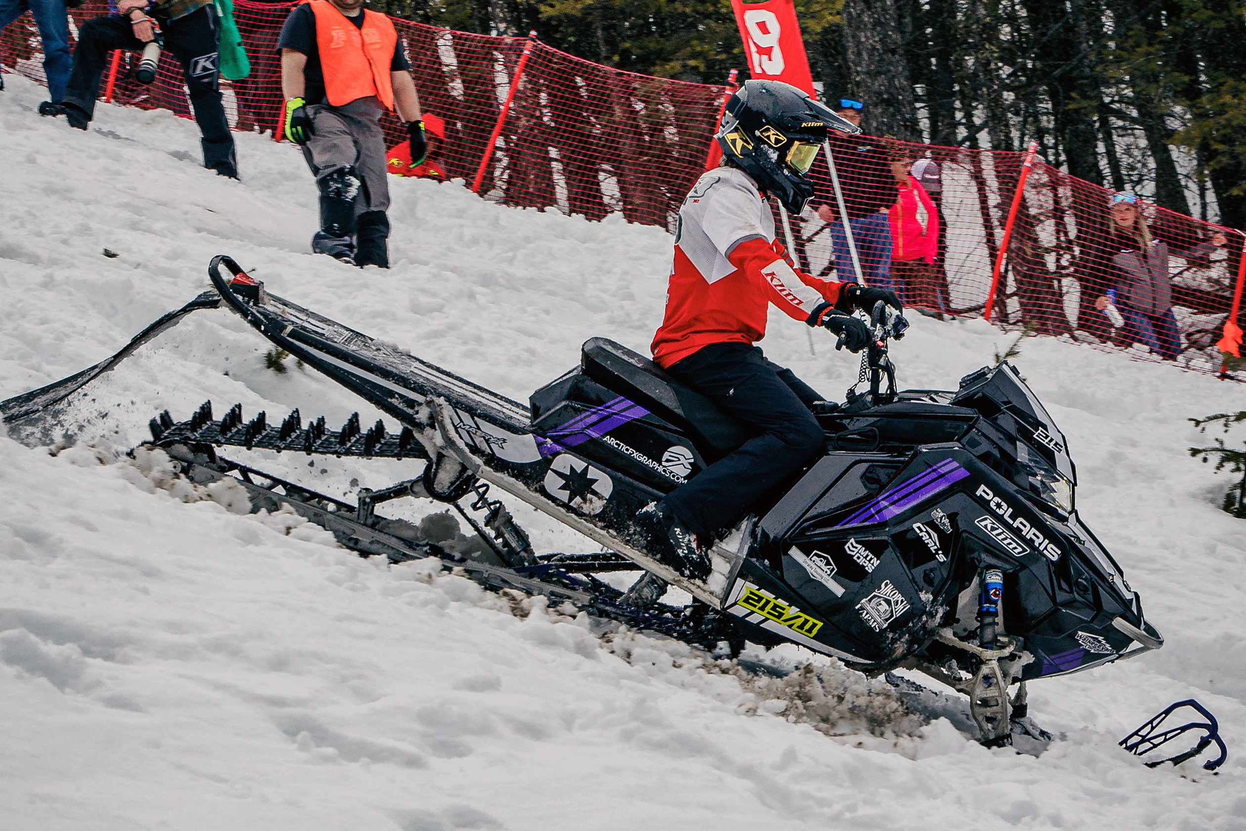 A Polaris Matryx Mountain snowmobile with a white, purple, and black Cobra MC custom vinyl wrap.