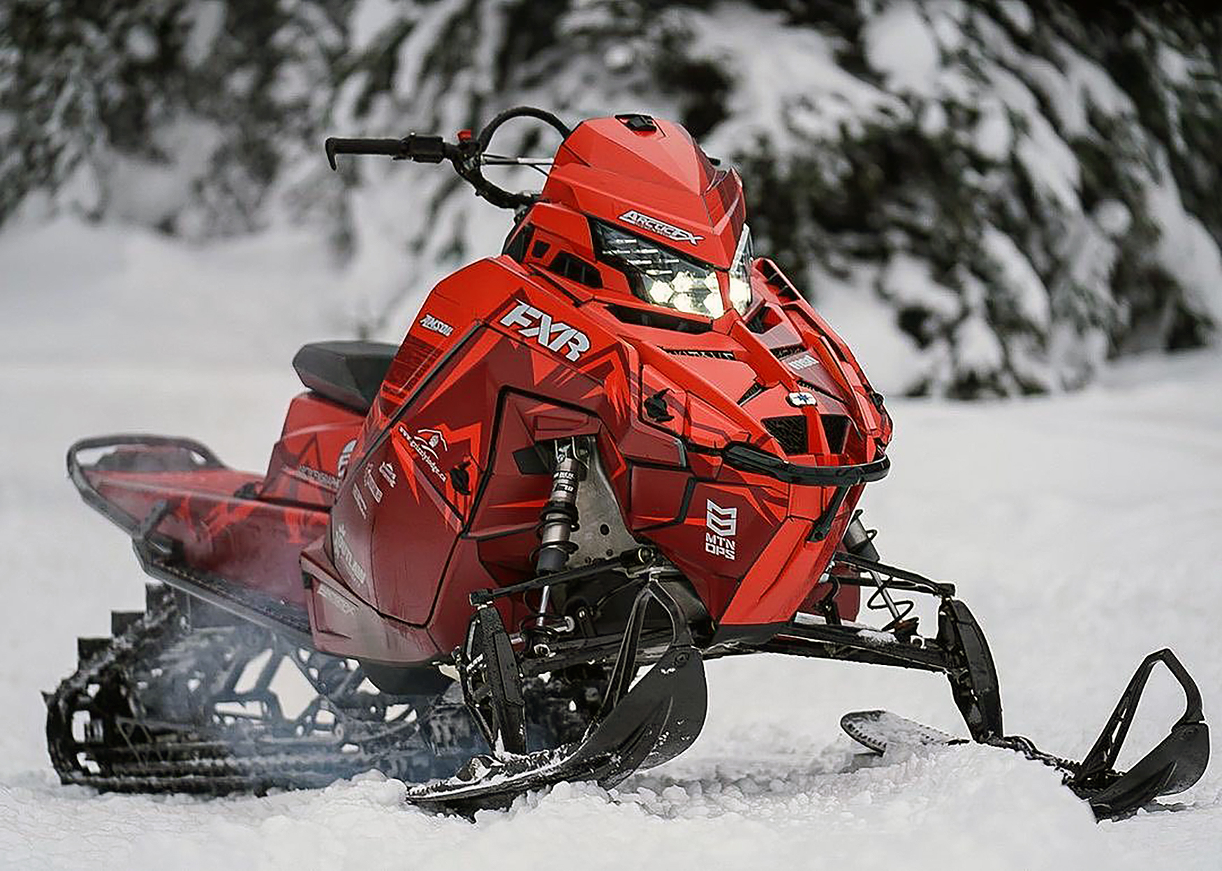 A Polaris Matryx Mountain snowmobile with a red and gray RR Ransom custom vinyl wrap.