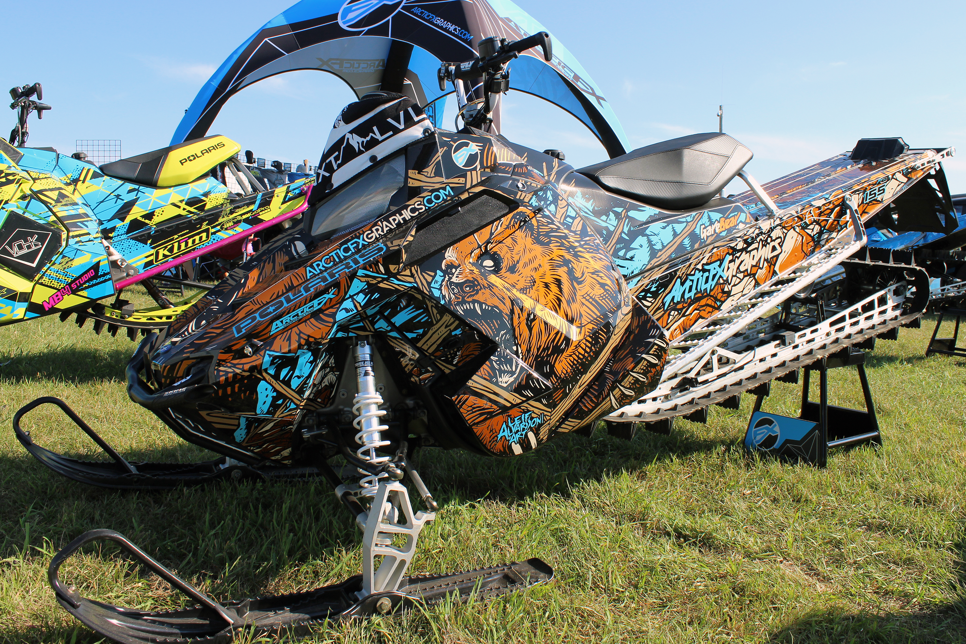 A Polaris Pro-Ride snowmobile with a blue, black, and brown Leif Alvarsson Kodiak custom vinyl wrap.