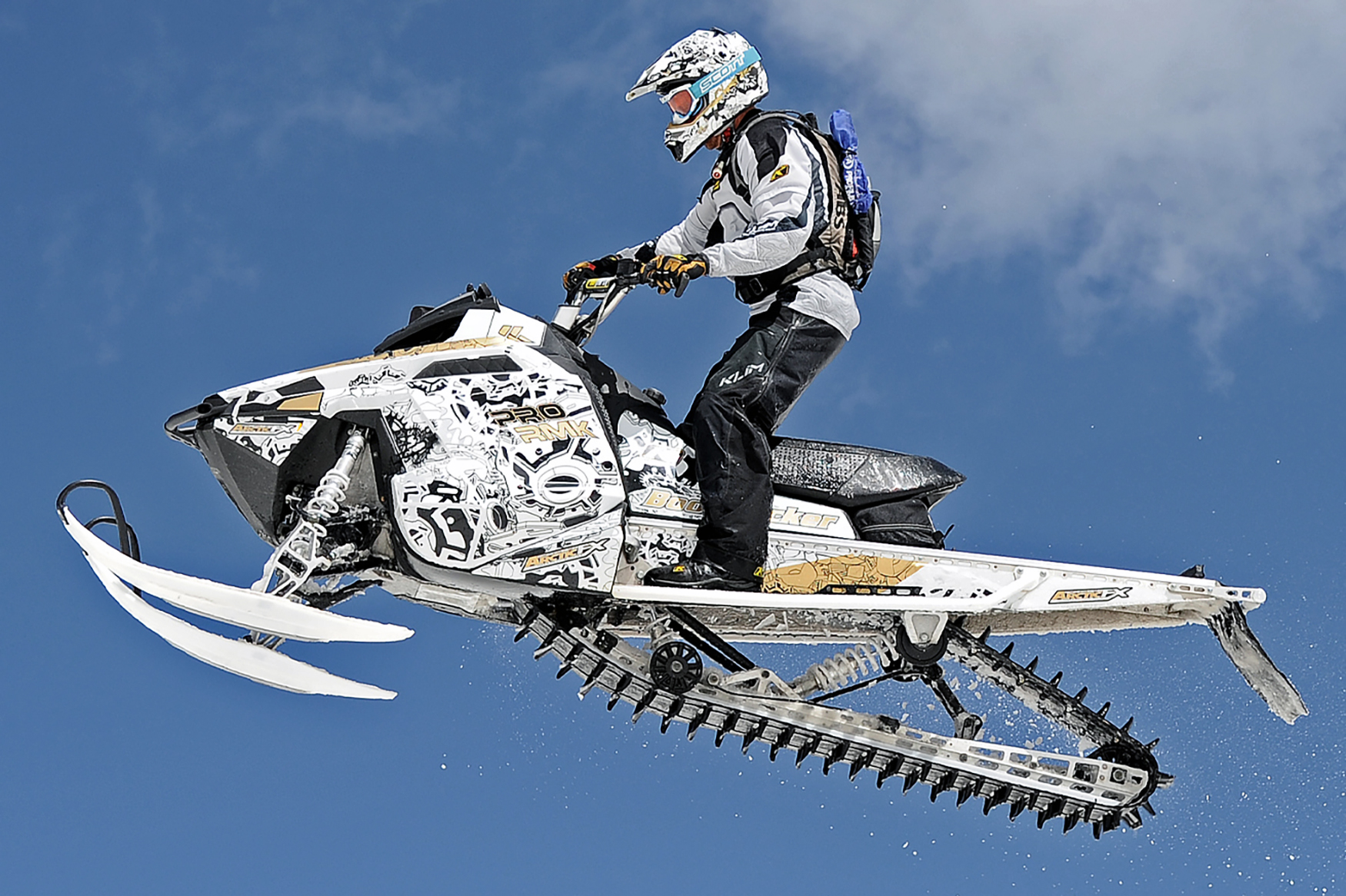 A Polaris Pro-Ride snowmobile with a black and white Klim Geared custom vinyl wrap.