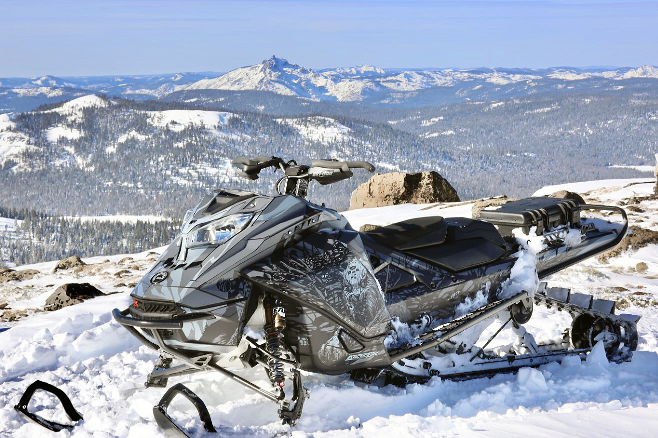 A Ski-Doo Gen4 Lightweight snowmobile with a gray and black Leif Alvarsson Ambush custom vinyl wrap.