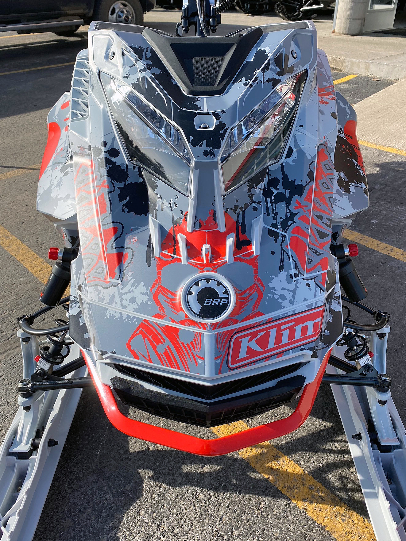 A Ski-Doo Gen4 Lightweight snowmobile with a white, red, and gray Tagged custom vinyl wrap.