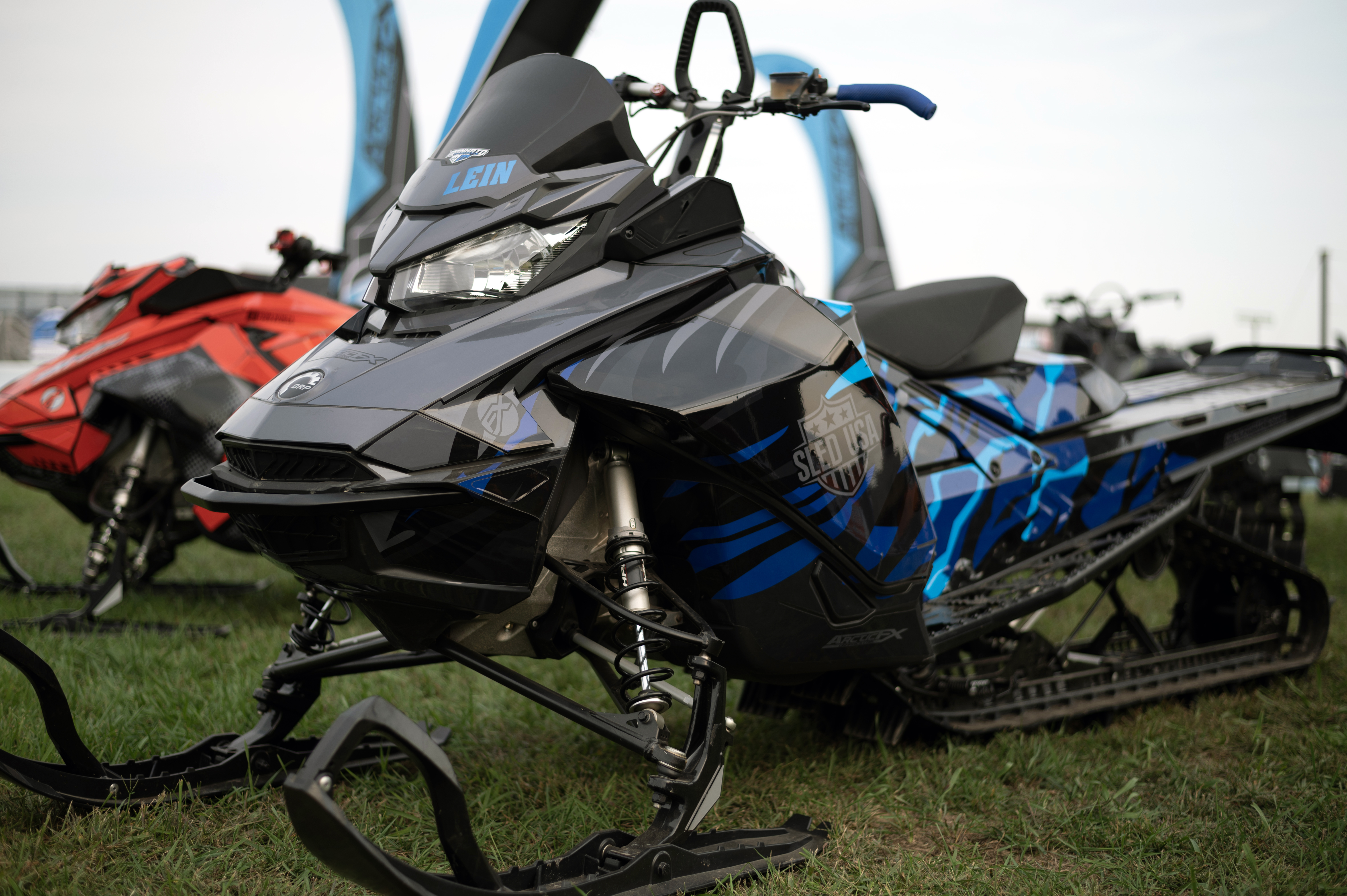 A Ski-Doo Gen4 Narrow Body snowmobile with a octane blue and black Leif Alvarsson Inferno custom vinyl wrap.