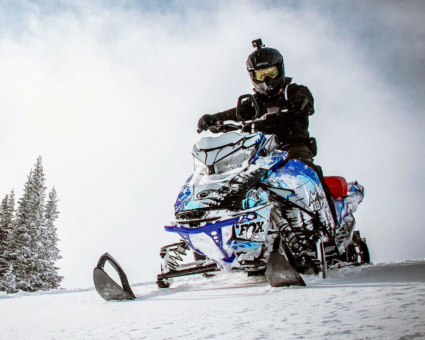 A Ski-Doo Gen4 Narrow Body snowmobile with a gray, blue, and black Sub Zero custom vinyl wrap.