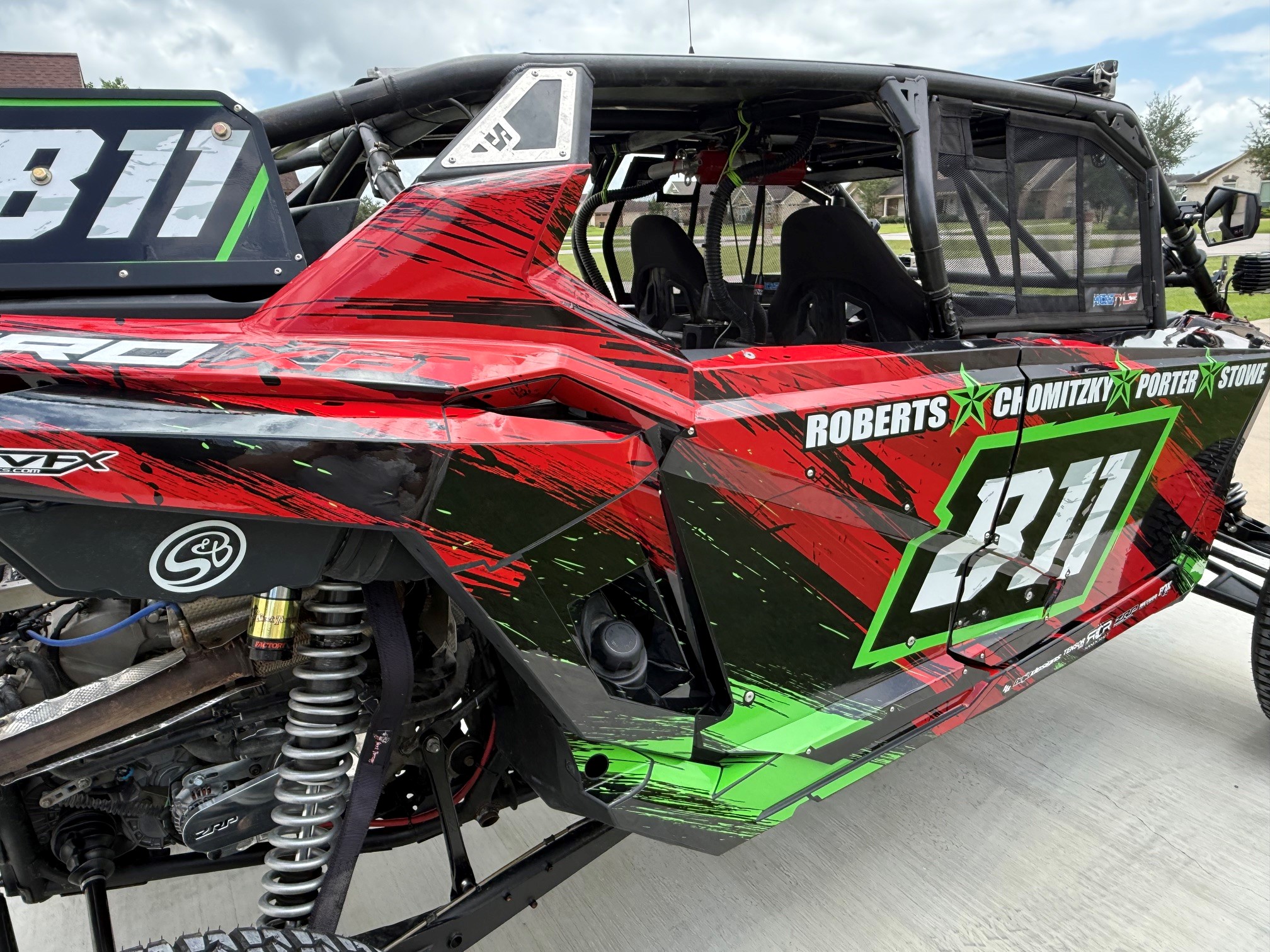 A Polaris RZR PRO XP 4 Door side-by-side with a custom design vinyl wrap.