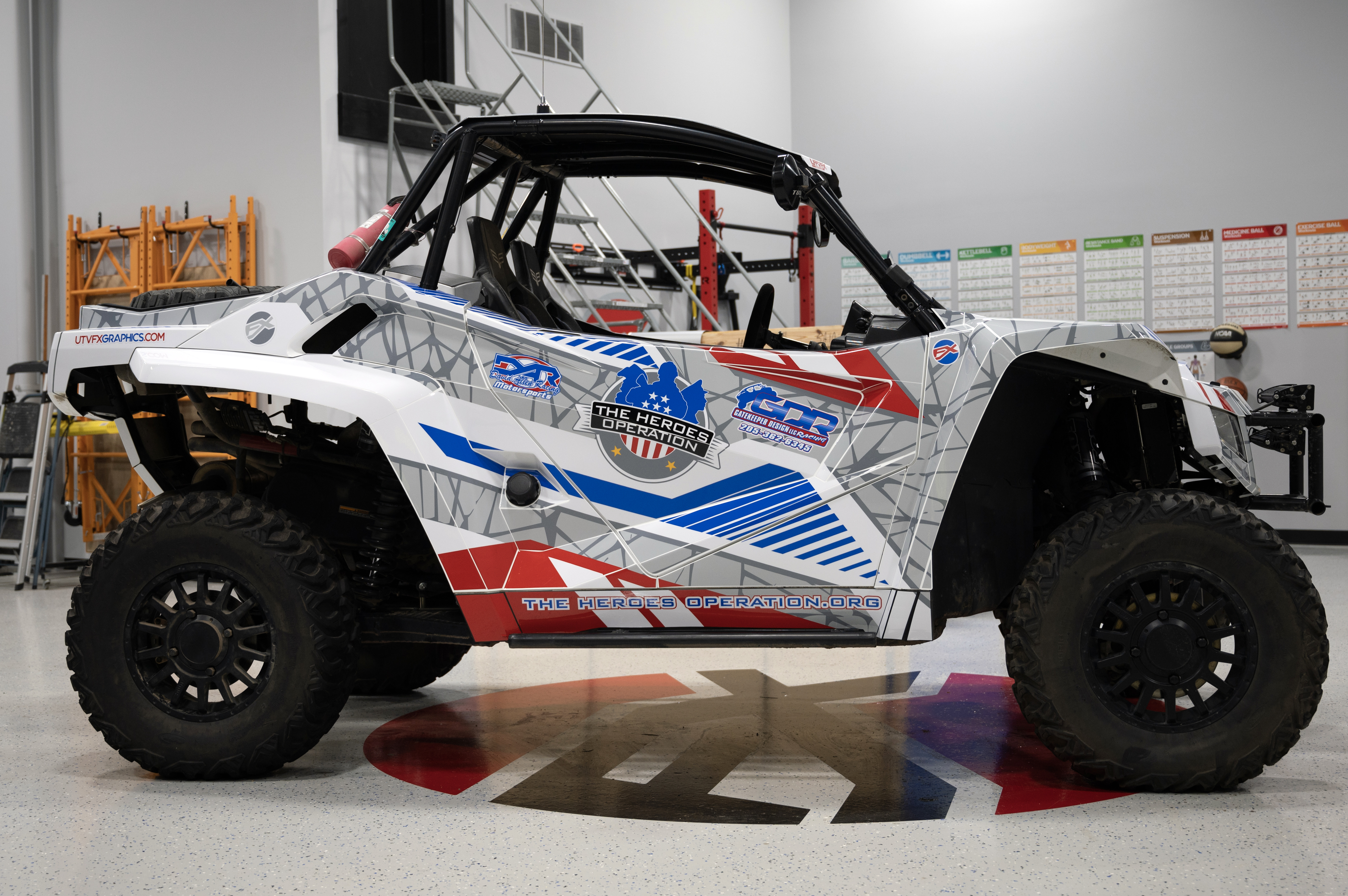A Arctic Cat Wildcat XX side-by-side with a red, white, and blue American hero Fractal custom vinyl wrap.