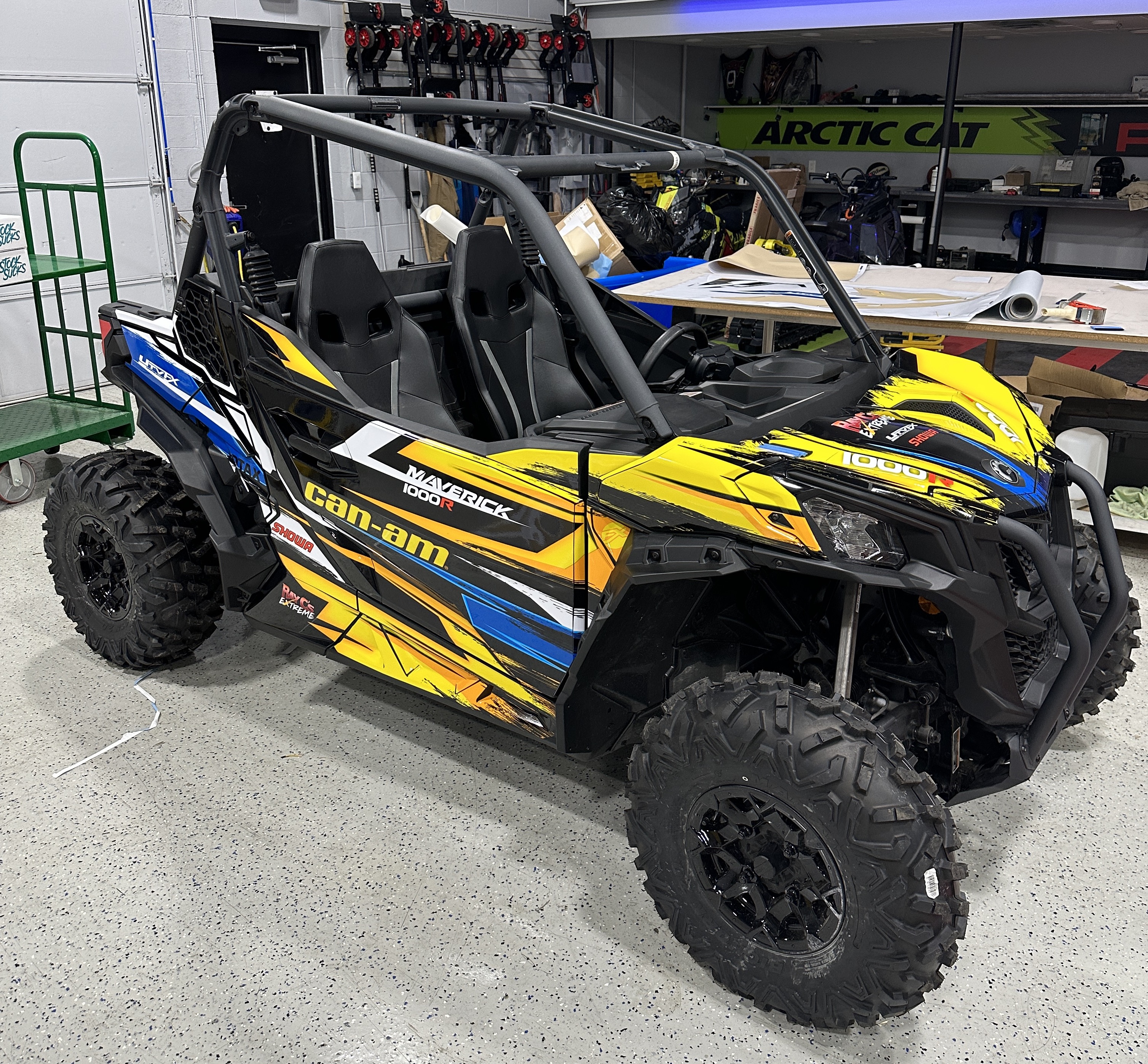 A Can-Am Maverick Sport side-by-side with a Ray C's custom Stripes and Grunge vinyl wrap