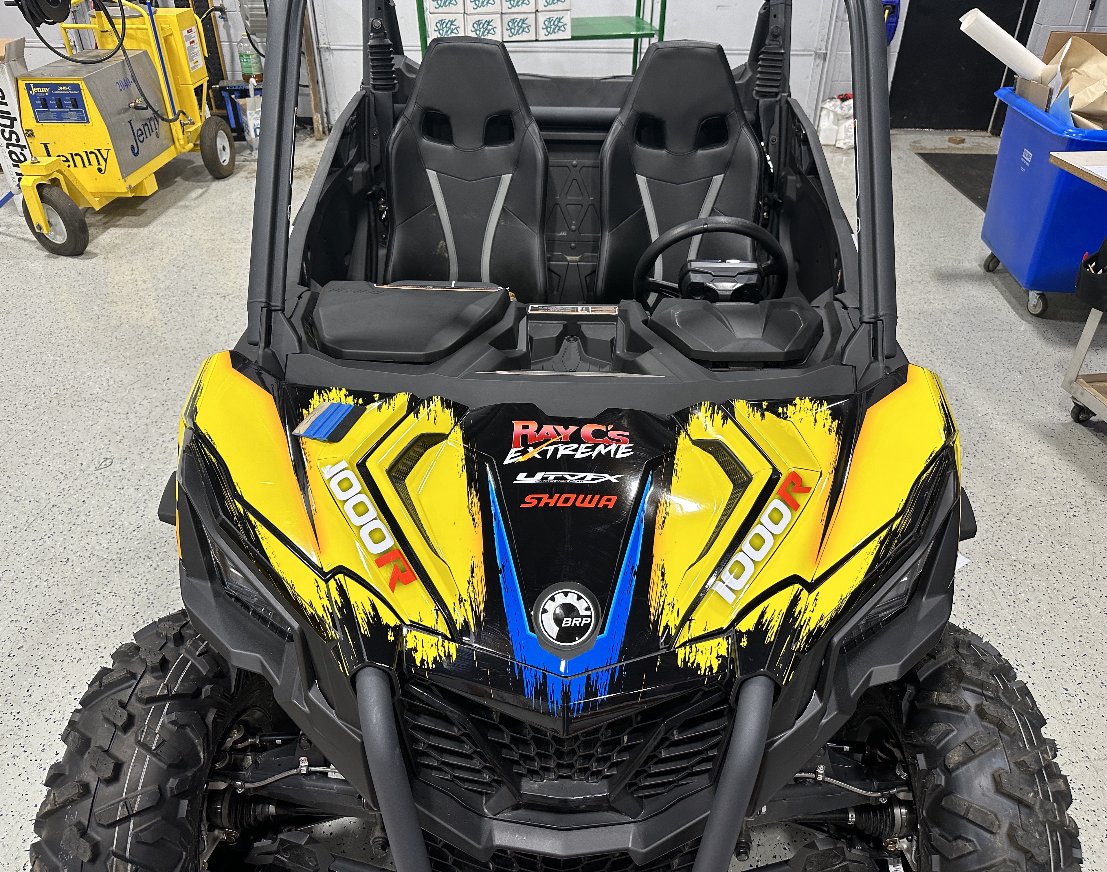 A Can-Am Maverick Sport side-by-side with a Ray C's custom Stripes and Grunge vinyl wrap
