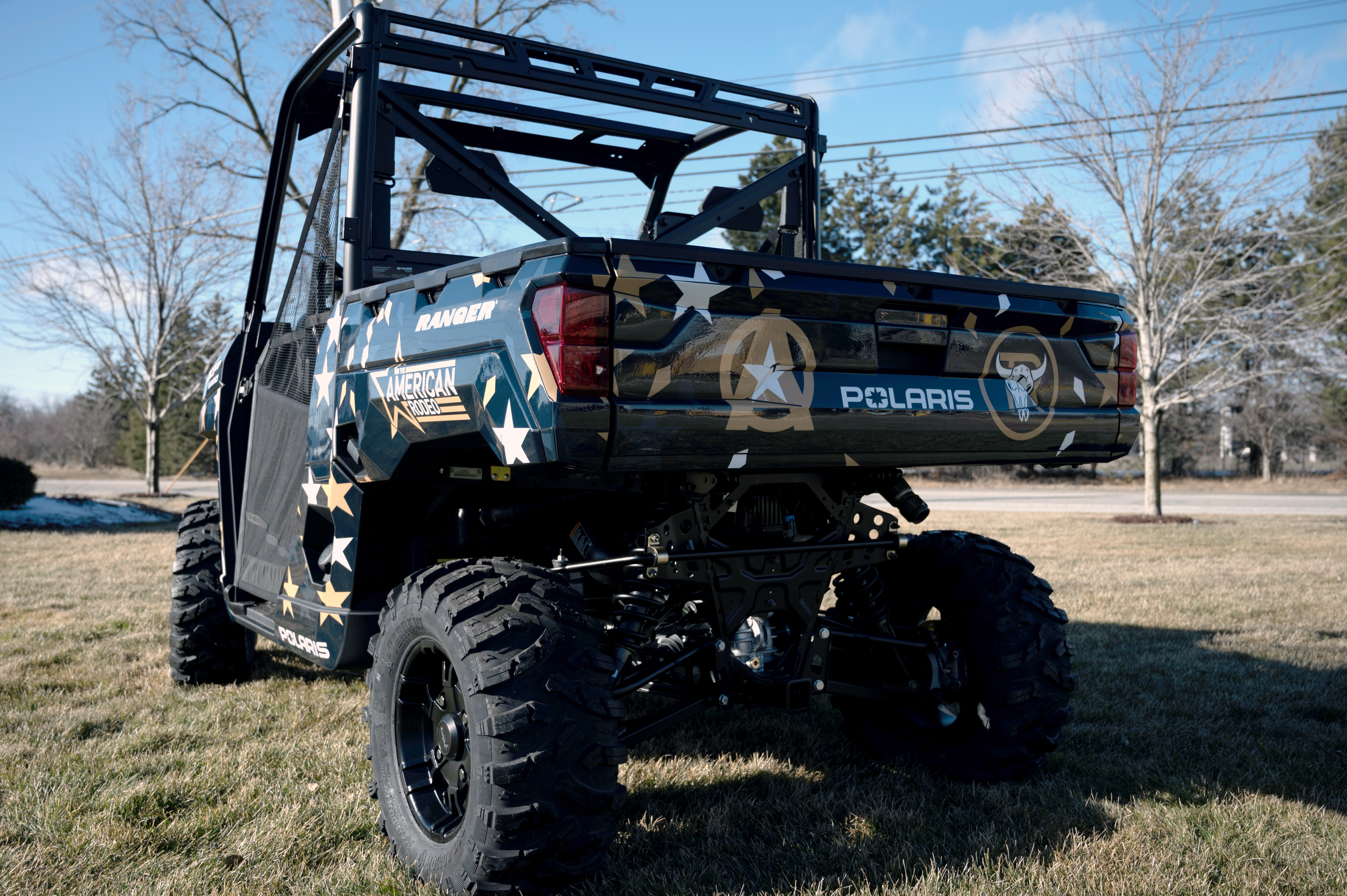 A Polaris Ranger 2 Door side-by-side with an American Rodeo custom vinyl wrap.