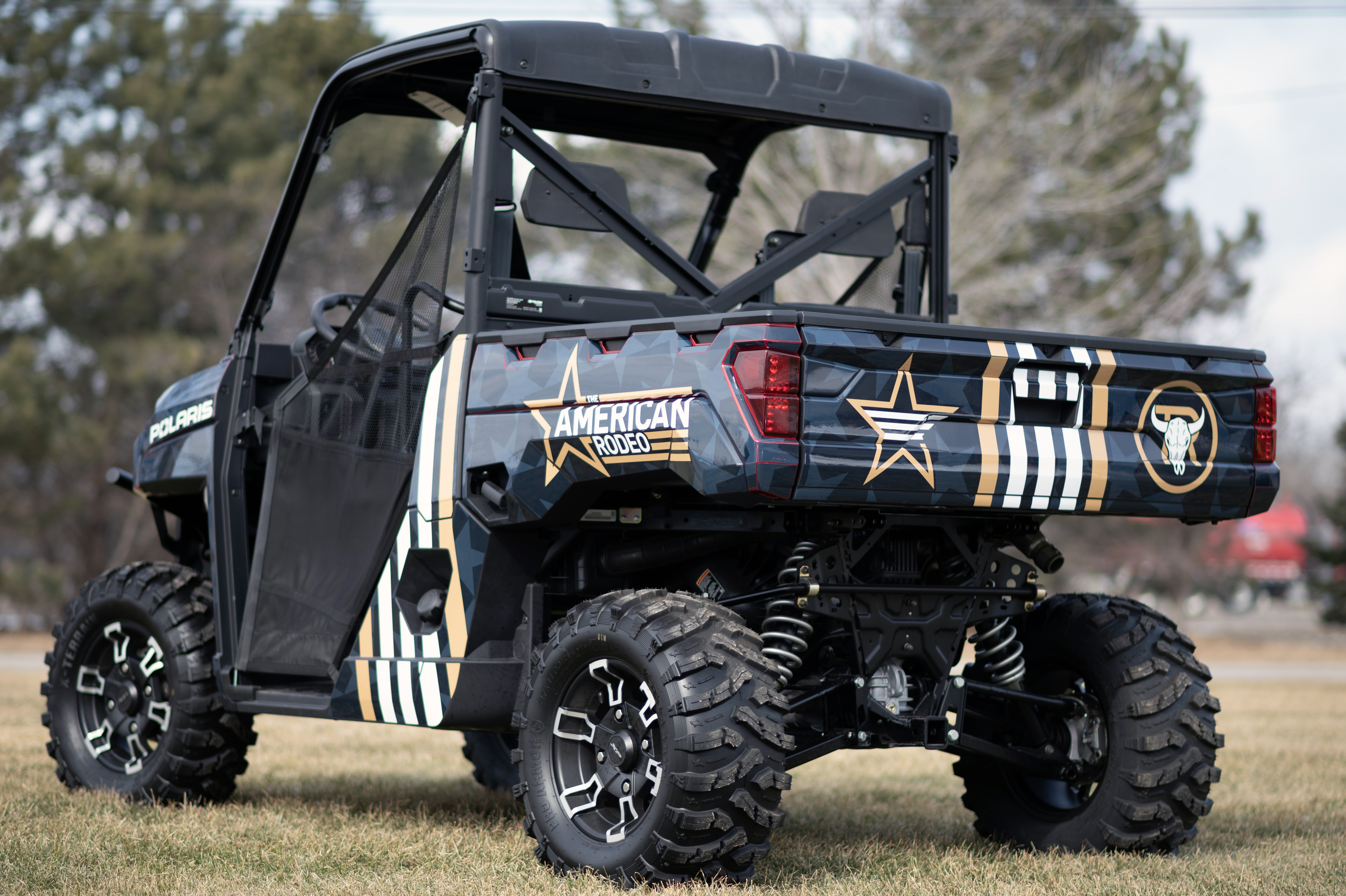 A Polaris Ranger 2 Door side-by-side with an American Rodeo custom vinyl wrap.