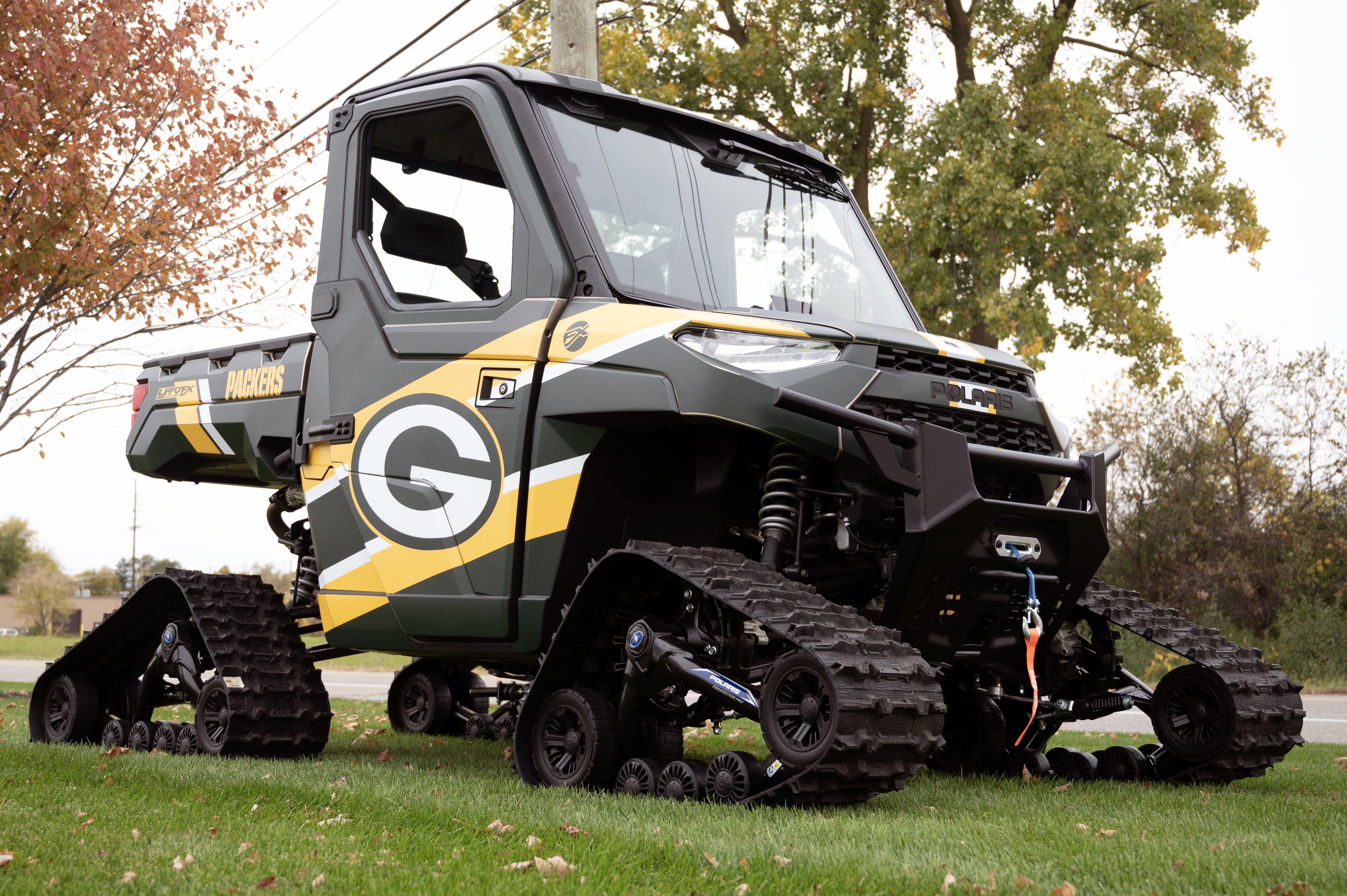 A Polaris Ranger 2 Door side-by-side with a Green bay Packers custom vinyl wrap.