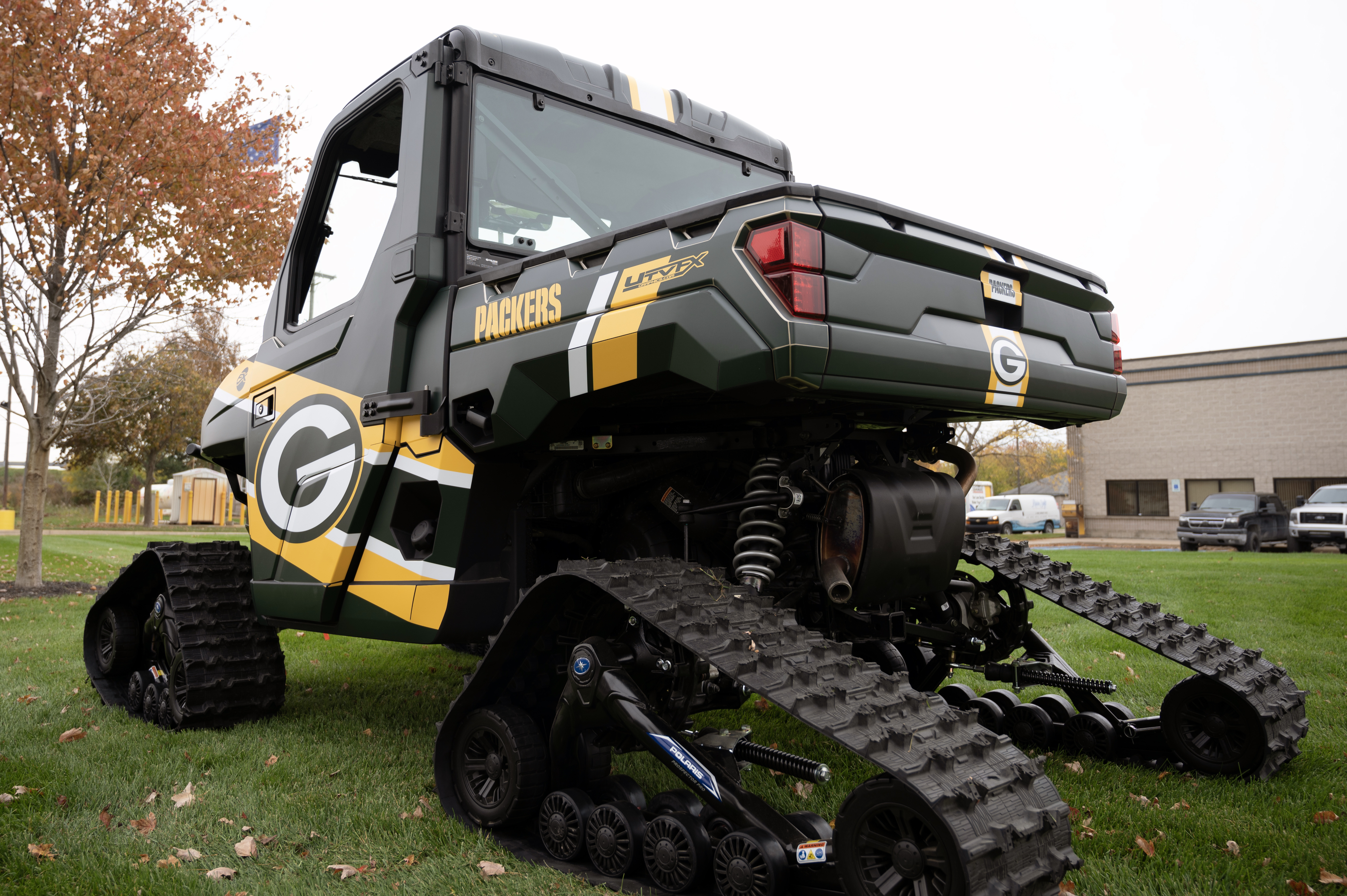 A Polaris Ranger 2 Door side-by-side with an American Rodeo custom vinyl wrap.