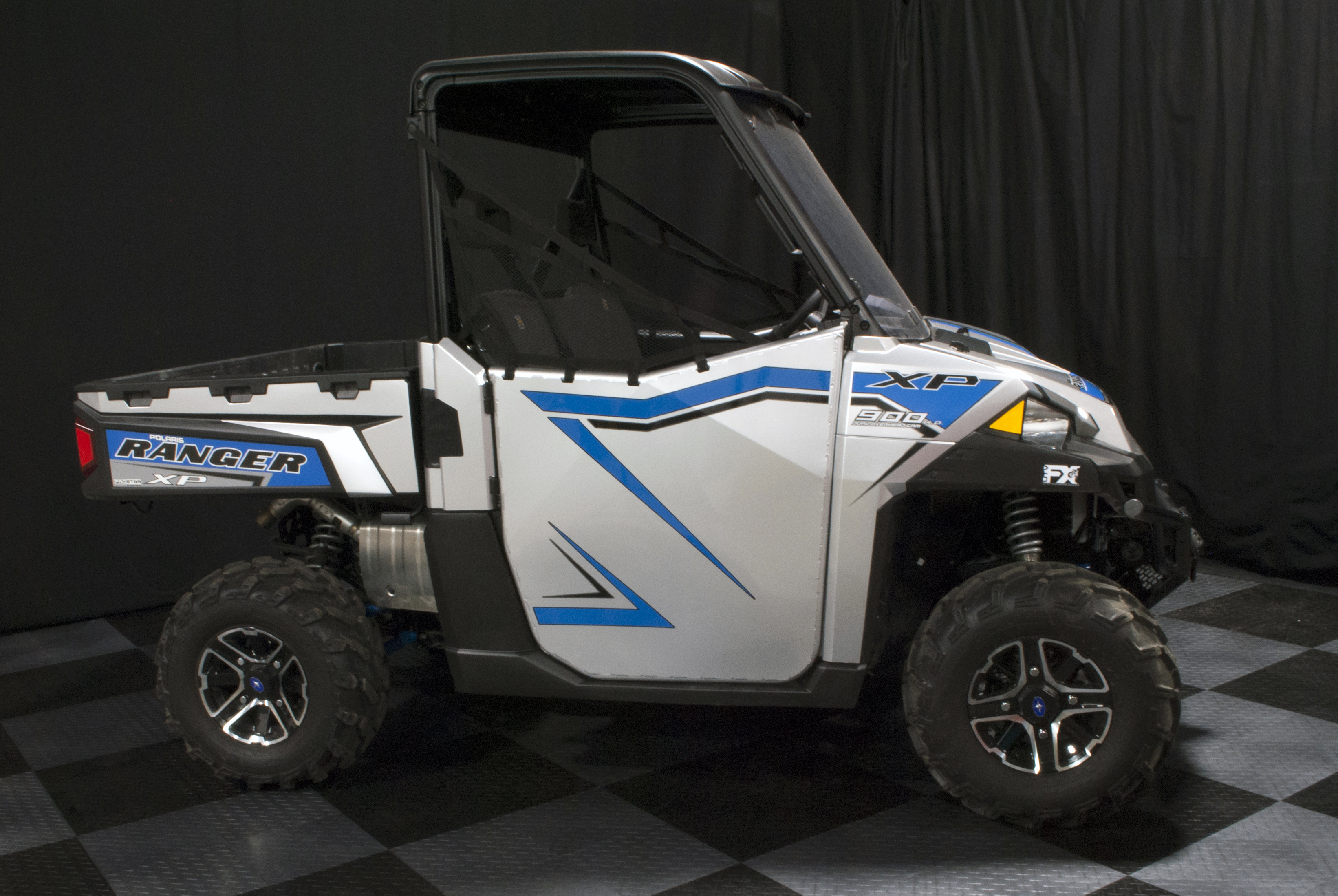 A Polaris Ranger 2 Door side-by-side with a stock door match custom vinyl wrap.