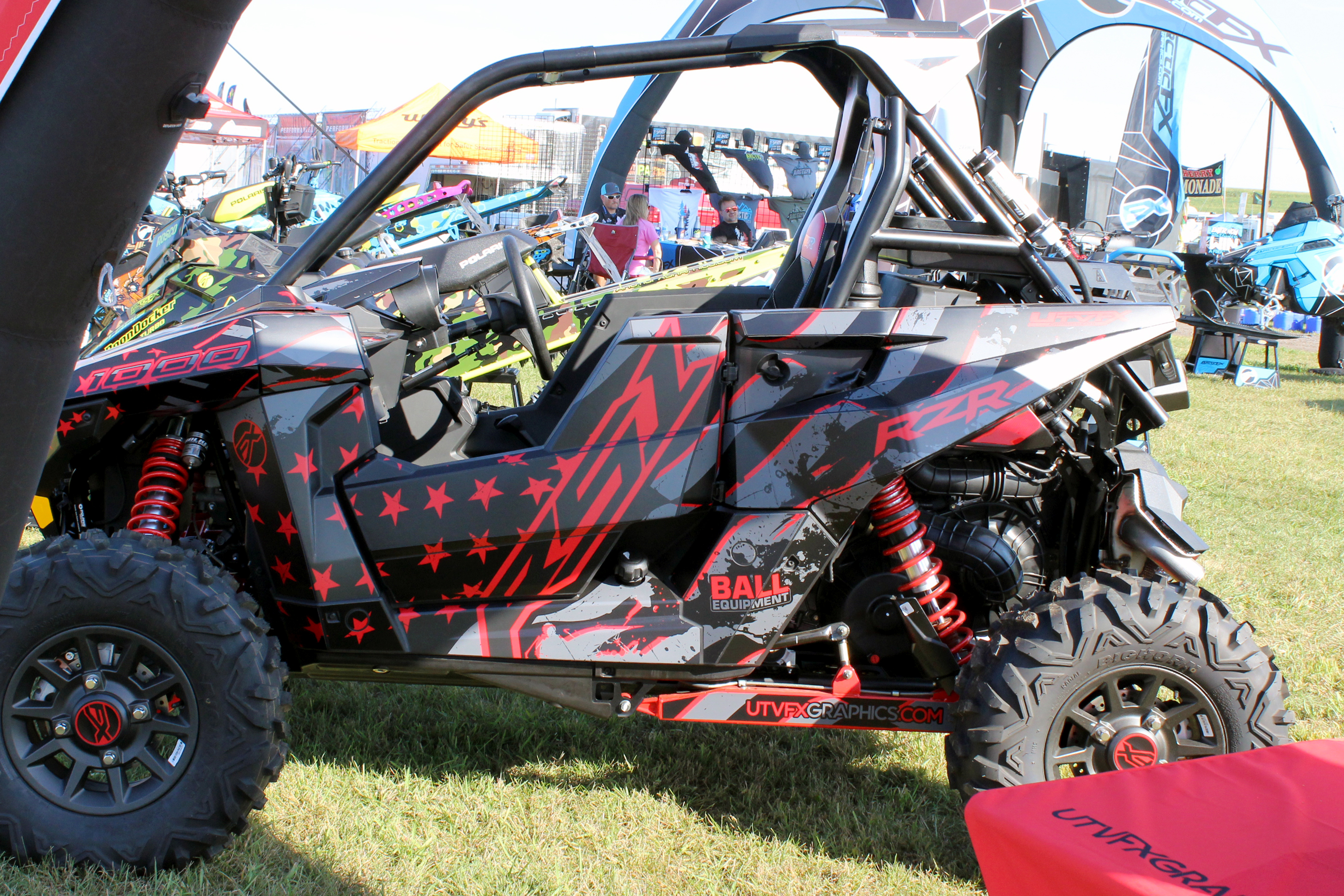 A Polaris RS1 side-by-side with a red, black, and gray American Flag custom vinyl wrap.