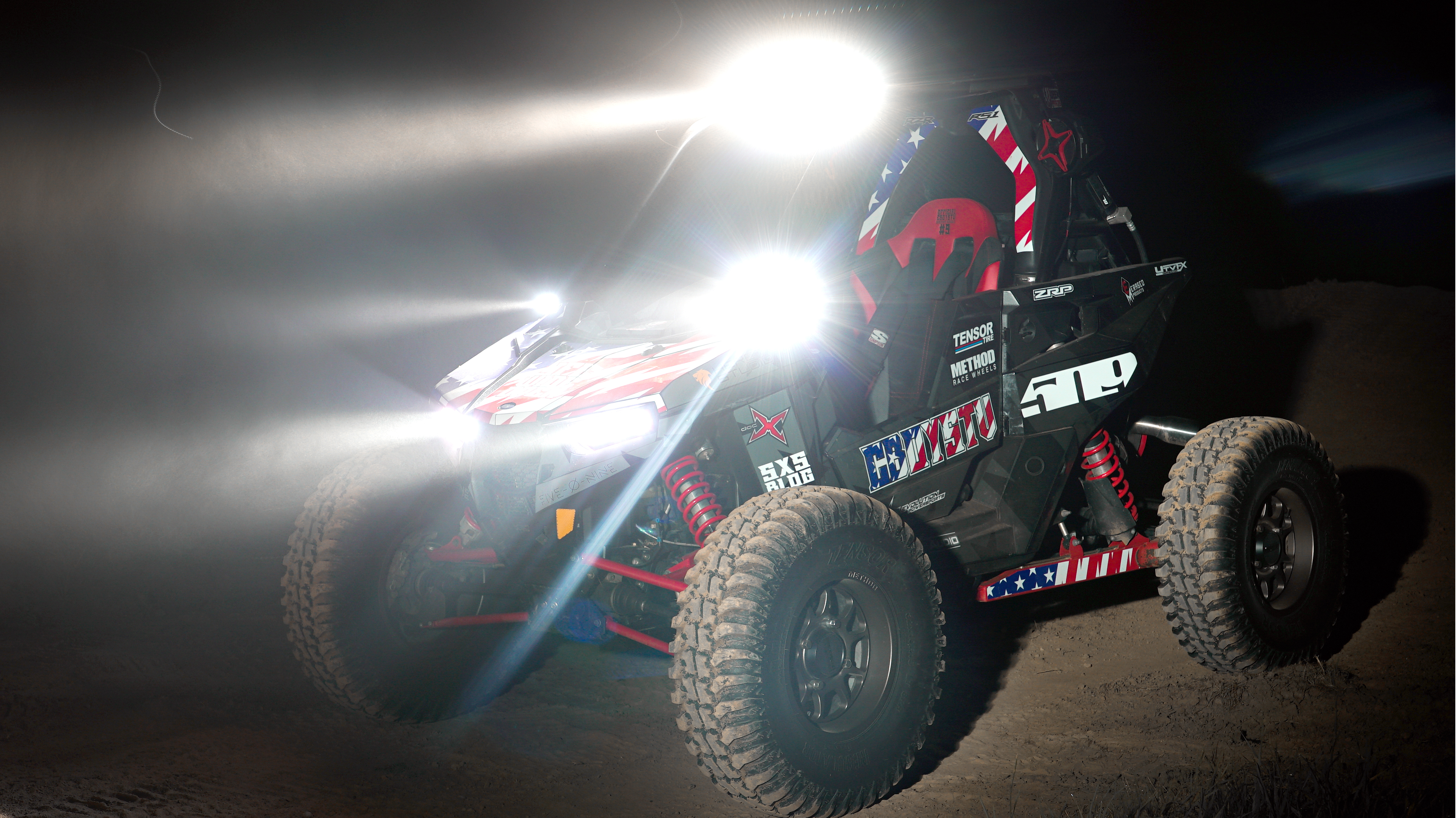 A Polaris RS1 side-by-side with a black and red CboysTV American Flag custom vinyl wrap.